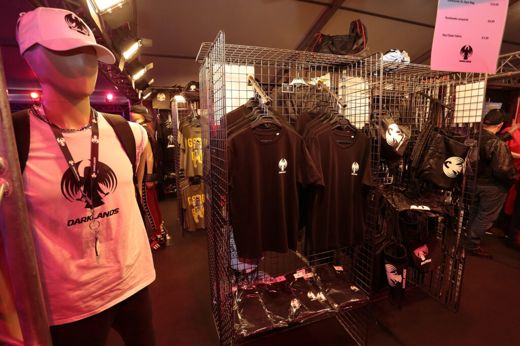 Rack with t-shirts and mannequin wearing Darklands gear at the Crew at Darklands Merchandise Shop